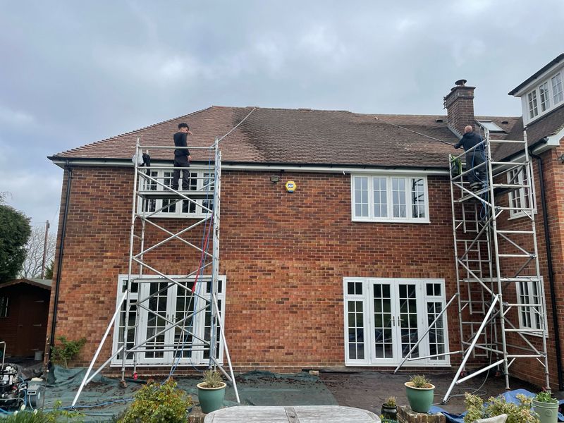 Roof cleaning carried out safely from scaffold towers by The Roof Moss Cleaners in North Baddesley